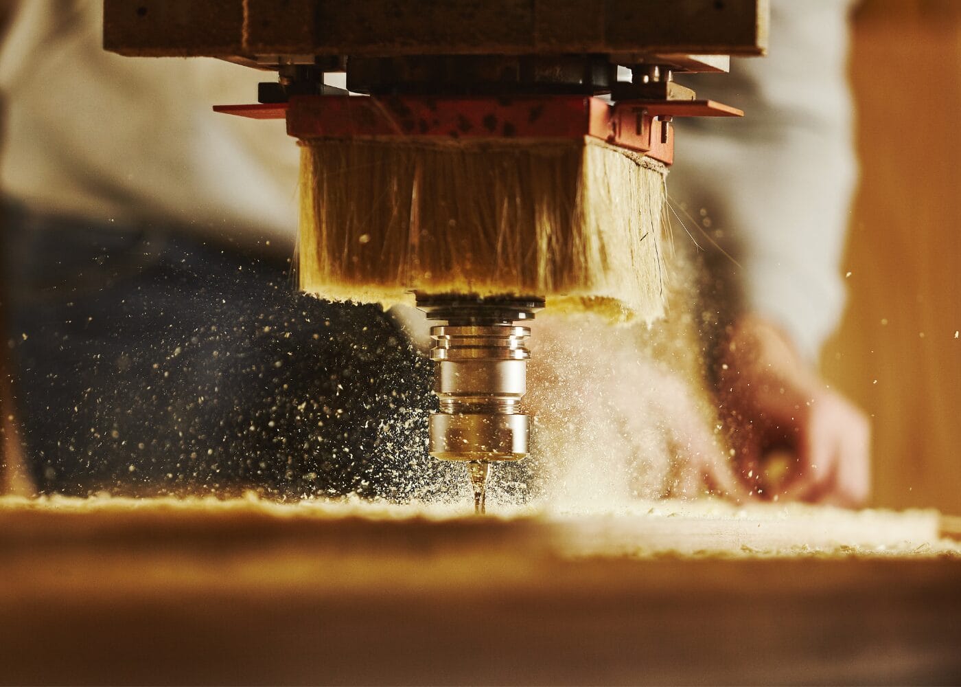 CNC router carving wood, creating sawdust